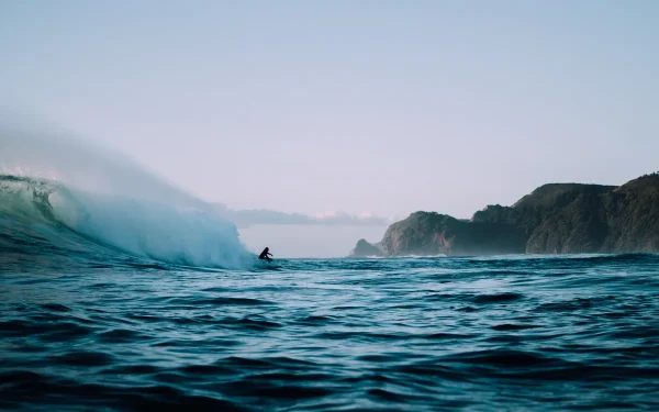 Surfing New Zealand beach waves