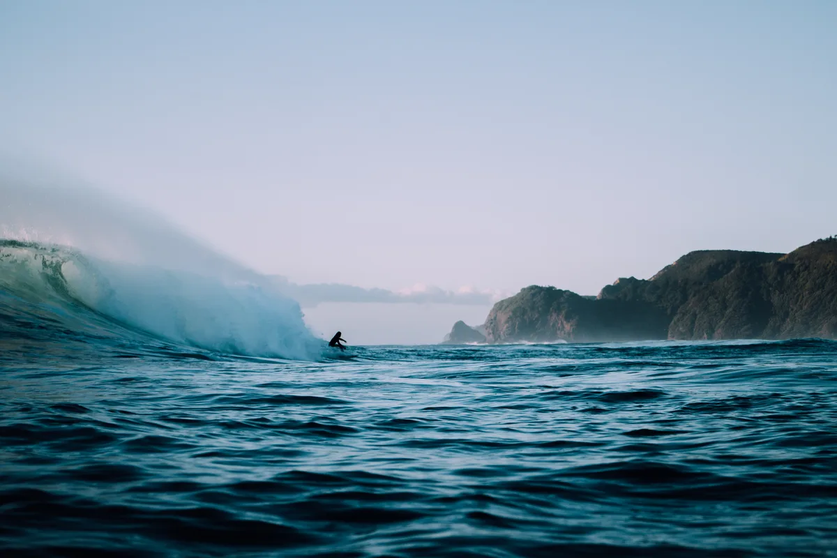 Surfing Whangamata waves