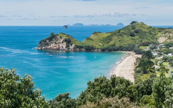 Aerial view of Hahei Beach with golden sand and clear water on the Coromandel Peninsula