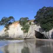 Rugged Coromandel Peninsula coastline under changeable New Zealand weather