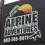 A person ziplining through a forest canopy on a flying fox, similar to the Coromandel canopy tour