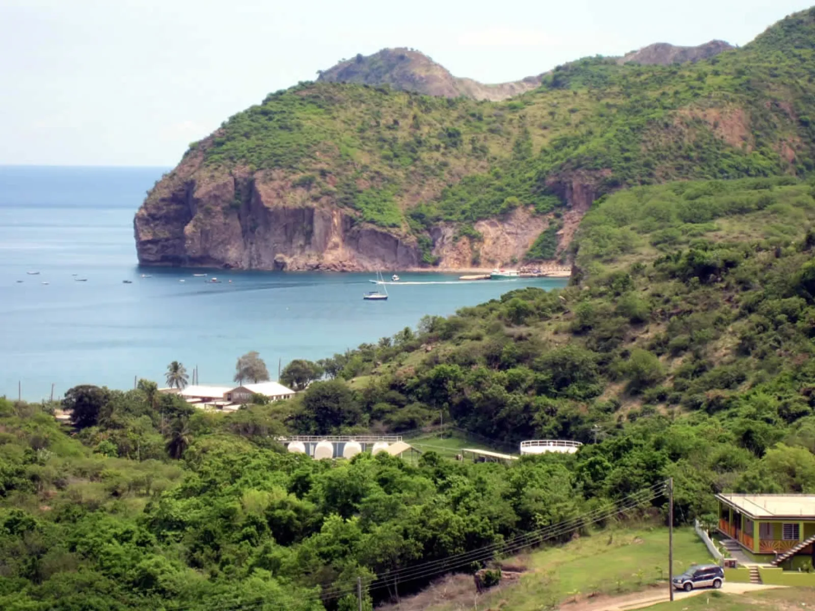 Little Bay beach on the northern Coromandel Peninsula with native bush headlands and clear water