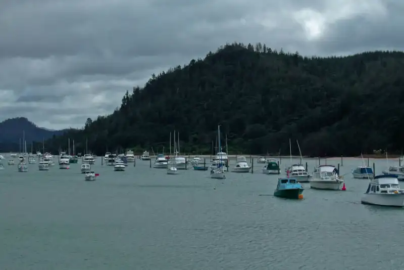 Boats in Whangamata Harbour on a cloudy winter day